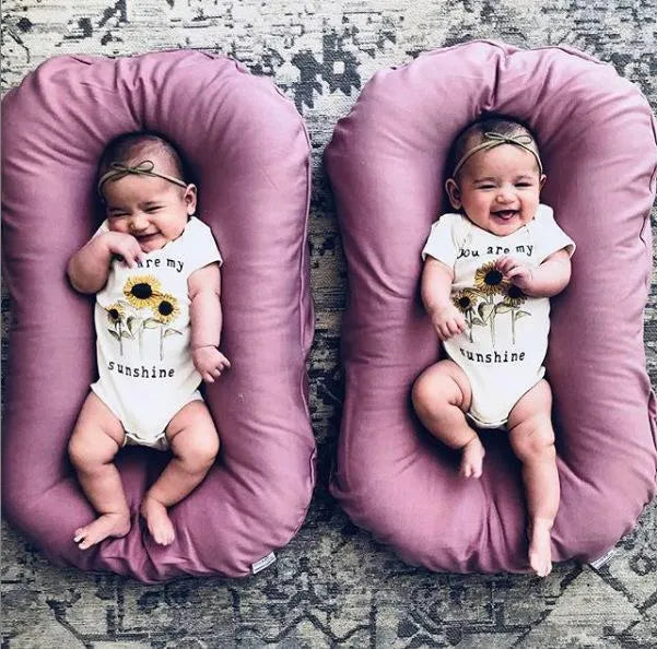 Beige portable cotton baby nest crib for infants measuring 75cm by 45cm