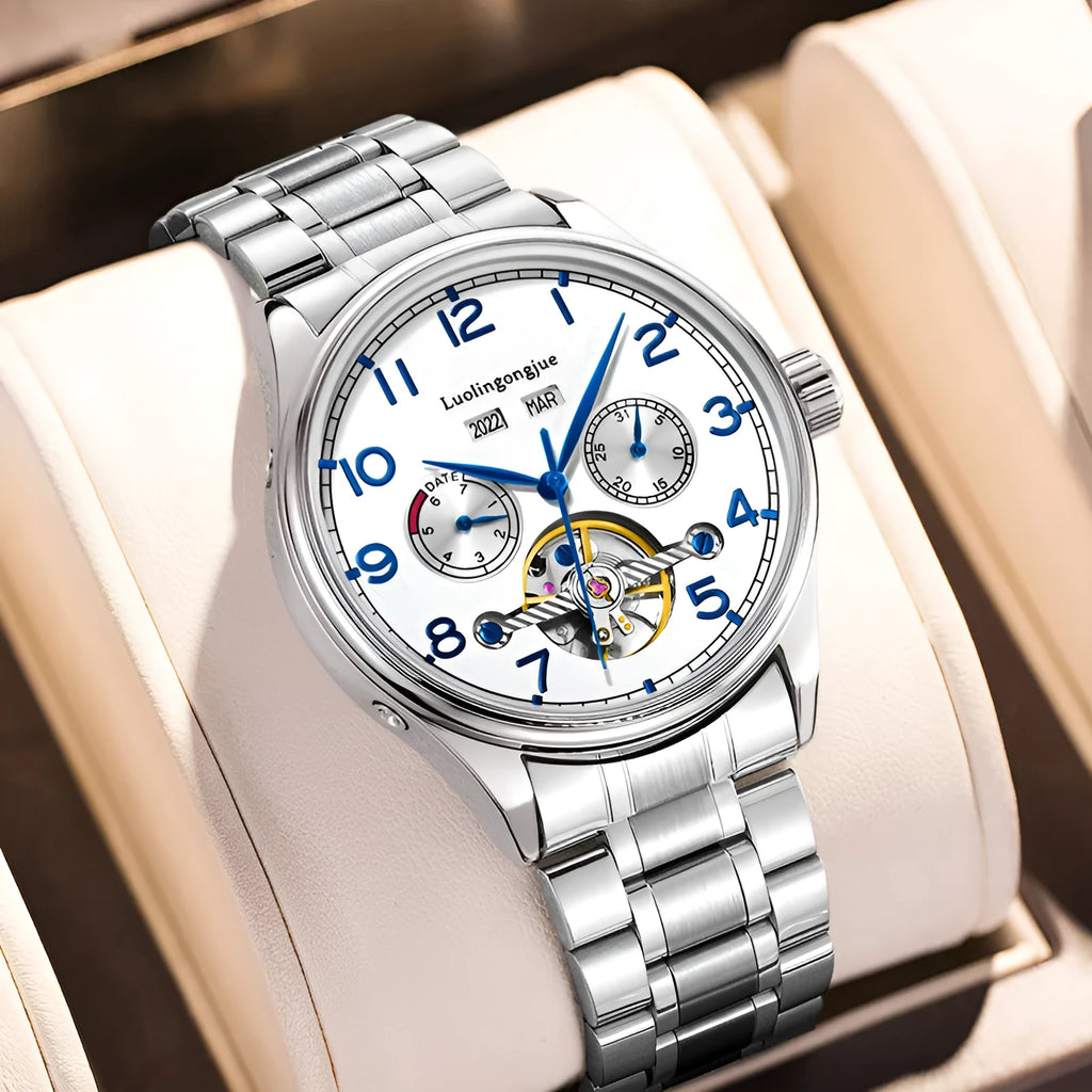 Men's stainless steel mechanical watch with a leather strap and sapphire crystal glass on a wrist.