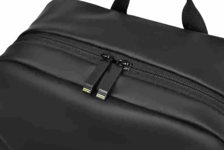 Waterproof PU leather laptop backpack in black, blue or grey with large capacity and laptop compartment