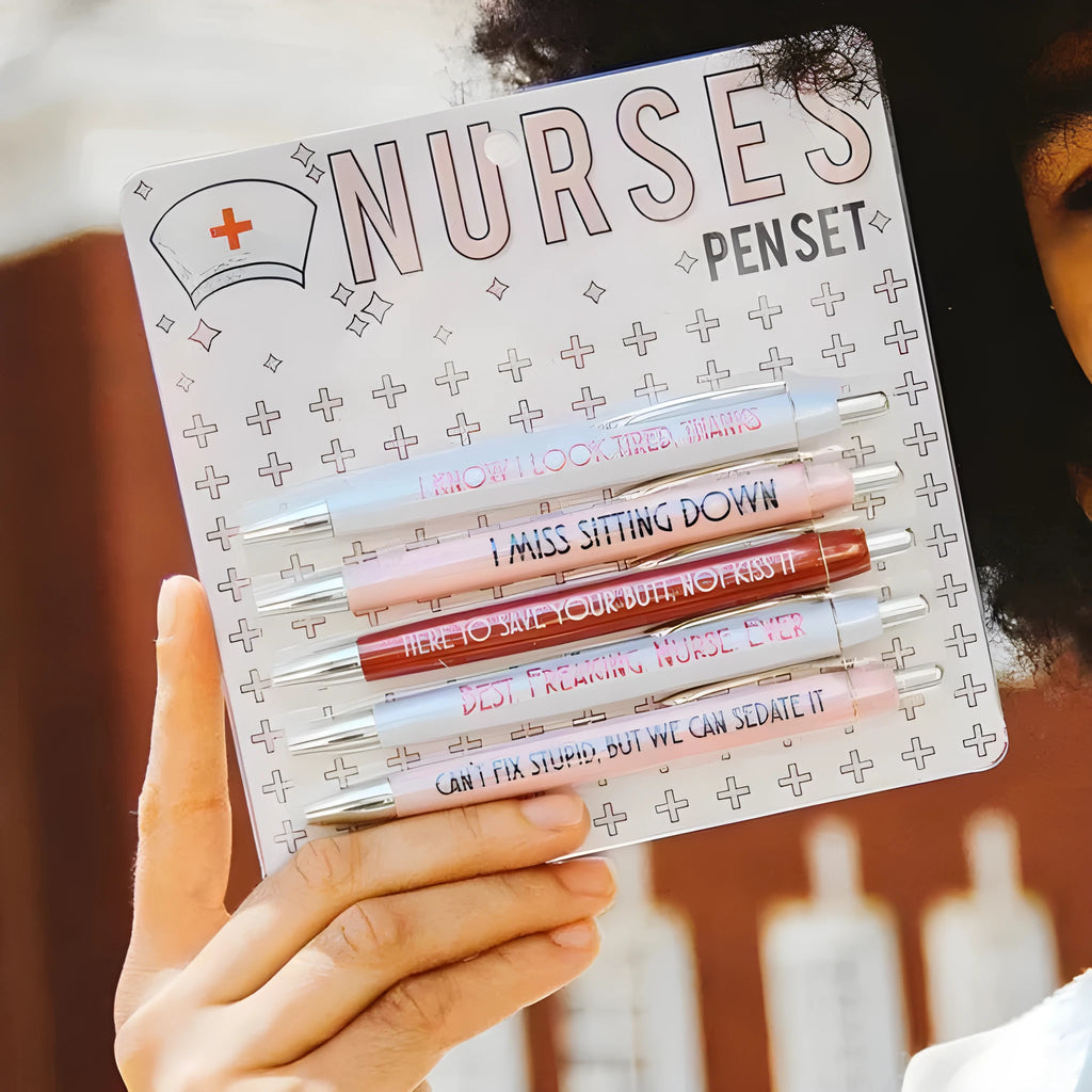 Set of five plastic retractable ballpoint pens with nurse-themed designs on the barrels.