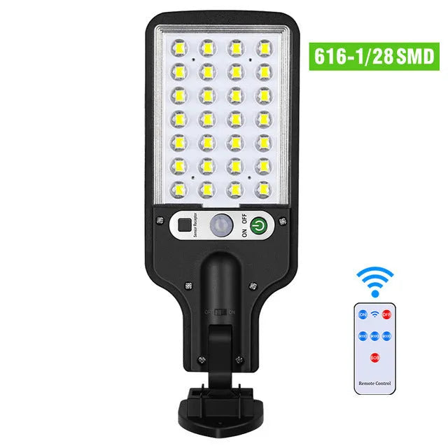 Outdoor solar LED wall lamp 28LED variant mounted on a garden fence for patio lighting