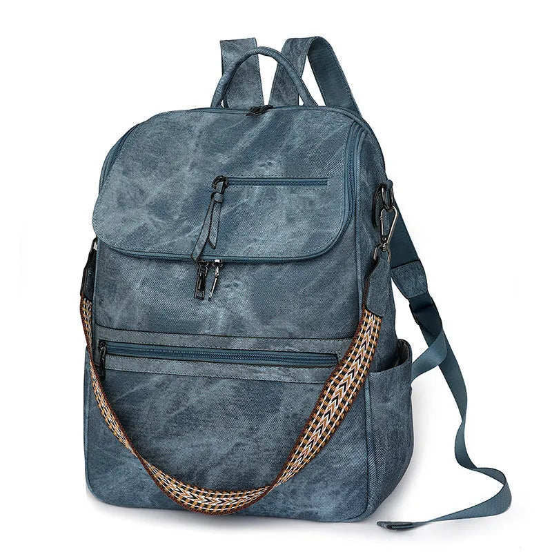 Solid-colour university backpack in PU leather with curved shoulder straps and minimalist stitching detail