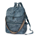 Solid-colour university backpack in PU leather with curved shoulder straps and minimalist stitching detail