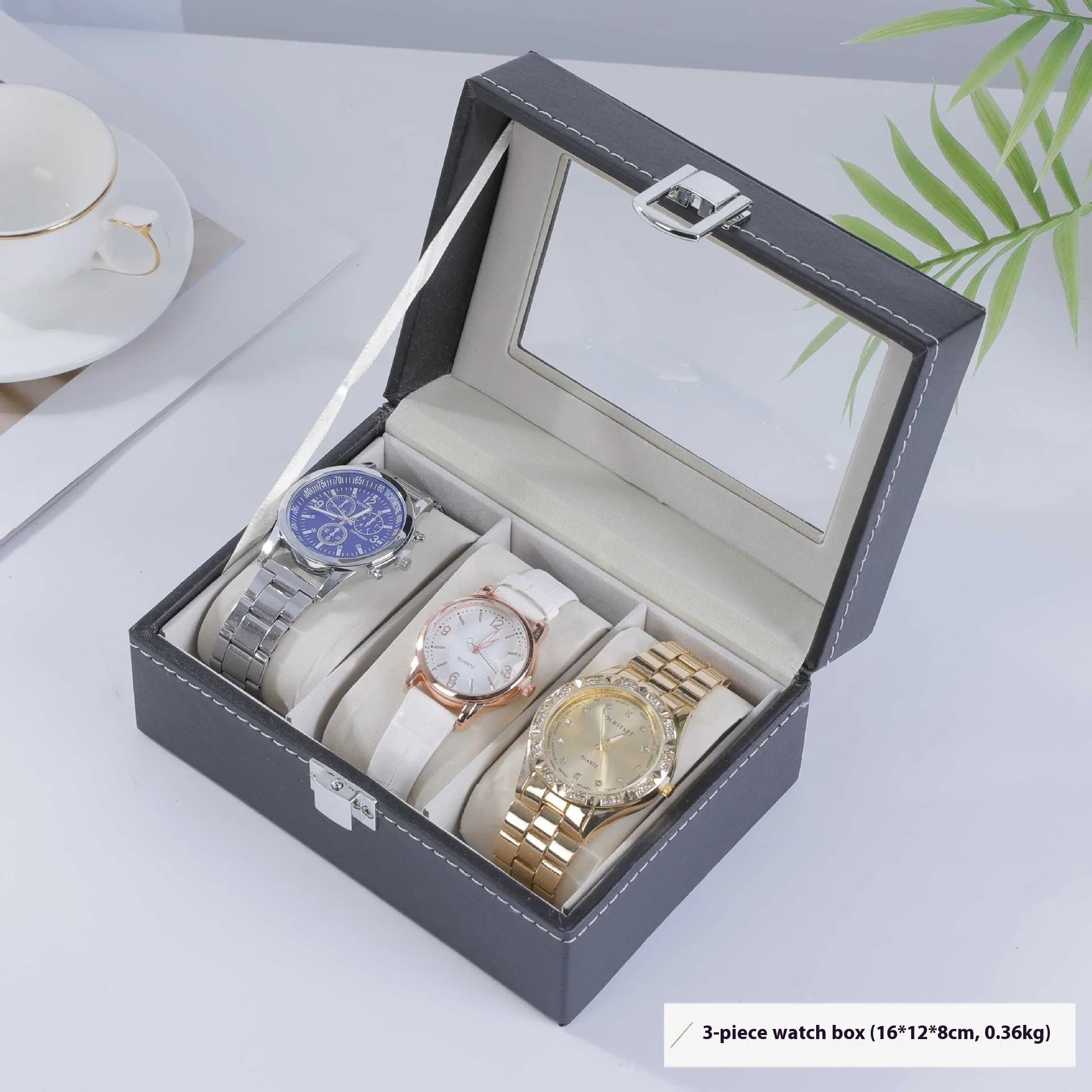 Grey leather watch storage box with a transparent dust cover, showing internal watch slots.