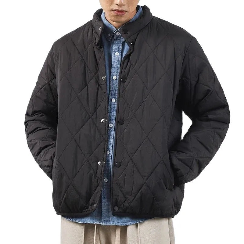 Men's black diamond lattice winter padded jacket showing extended length and loose fit