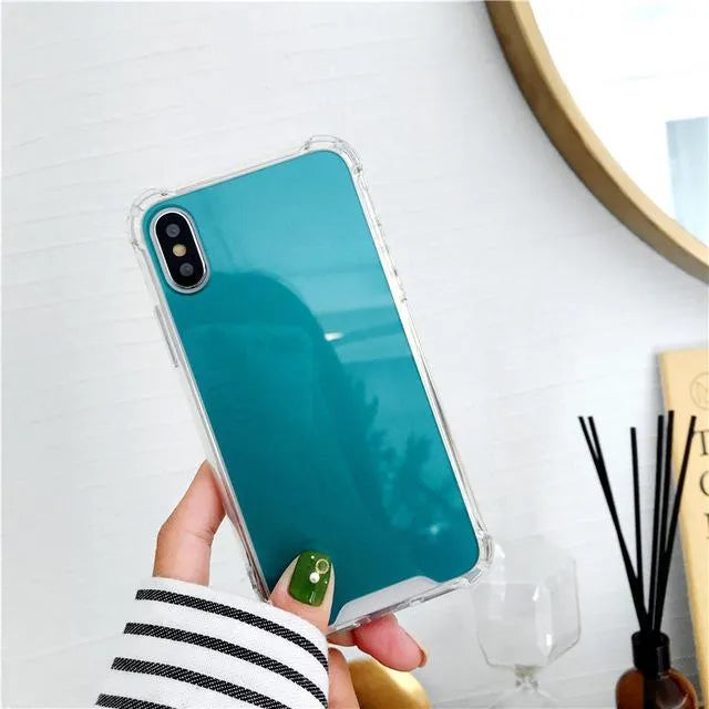 TPU mirror phone case for iPhone on a table, showing anti-fingerprint finish.