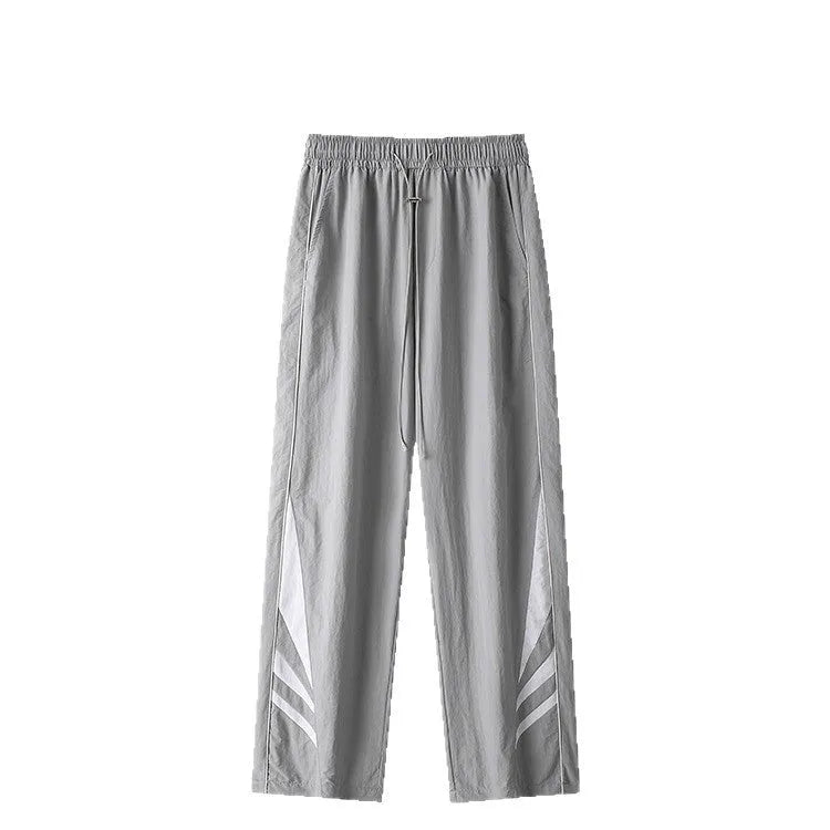 Men's straight leg loose-fit casual trousers in grey on a hanger.