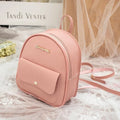 Small black PU women's shoulder backpack with zipper, shown next to a mobile phone for scale.