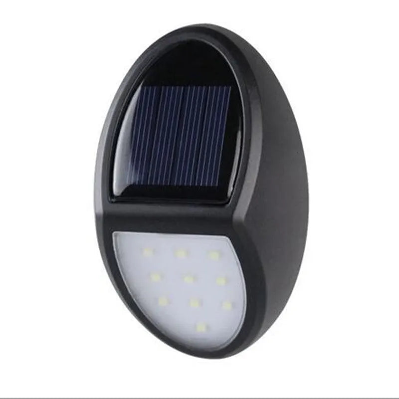 Black rectangular solar-powered LED wall light with a solar panel on top.