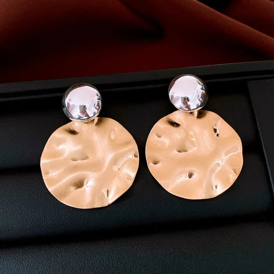 Round geometric earrings with electroplated iron and silver needle posts in gold or silver colour options