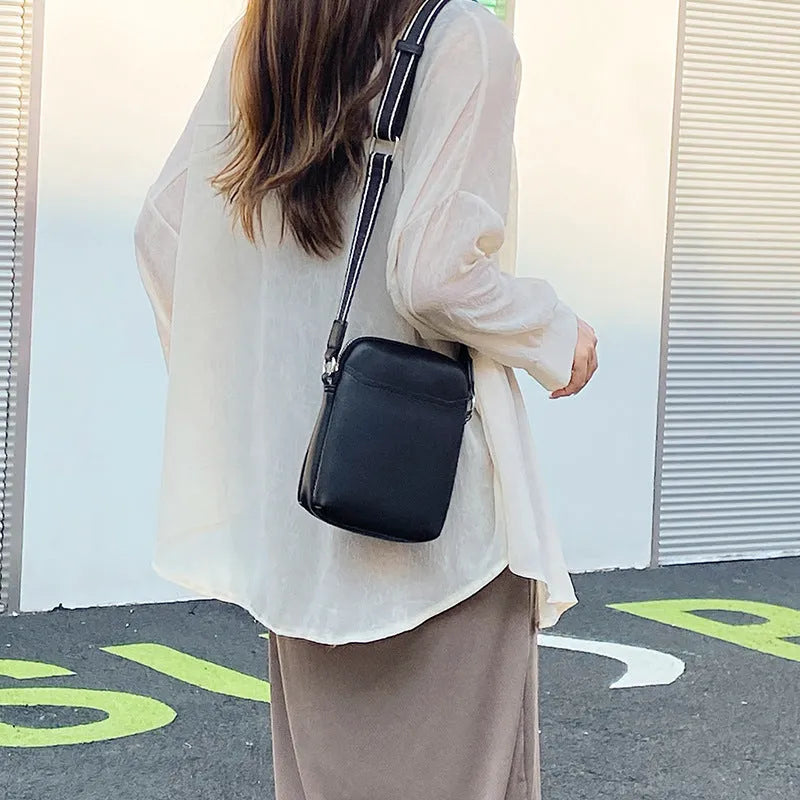 Solid colour women's PU crossbody phone bag shown in beige, displaying front view.