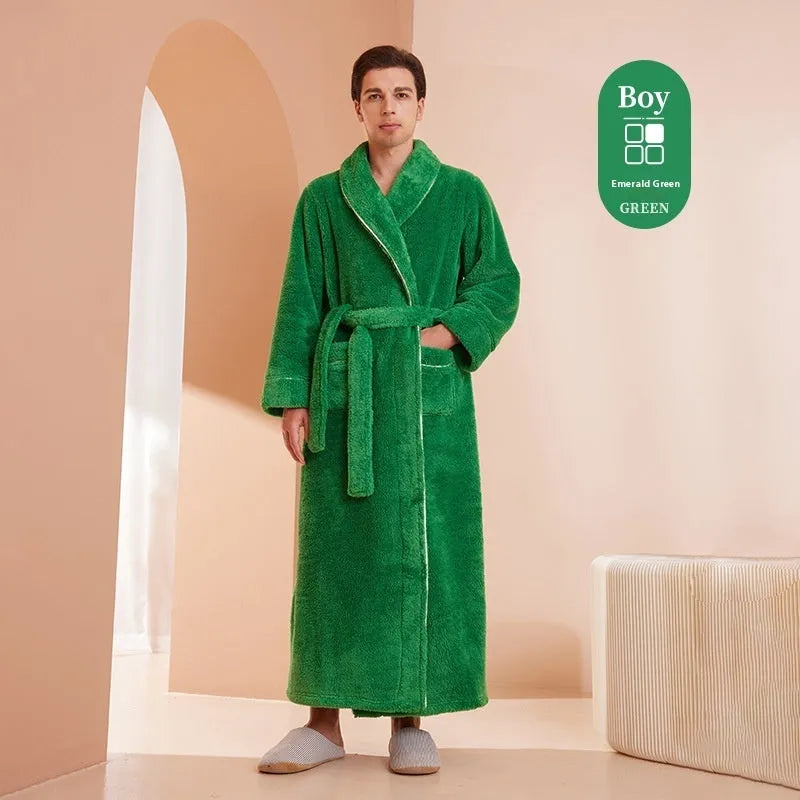 A man and woman wearing matching navy blue thick flannel bathrobes, showcasing the wrap-around design and plush fabric.