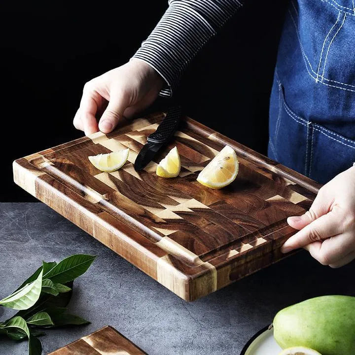 Brown parquet-pattern solid wood chopping board with 3cm thickness on a kitchen counter.