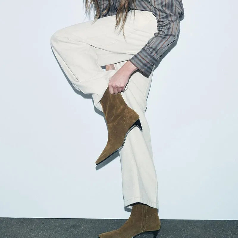 Brown square toe ankle boot with a side zip and a waterproof platform kitten heel.