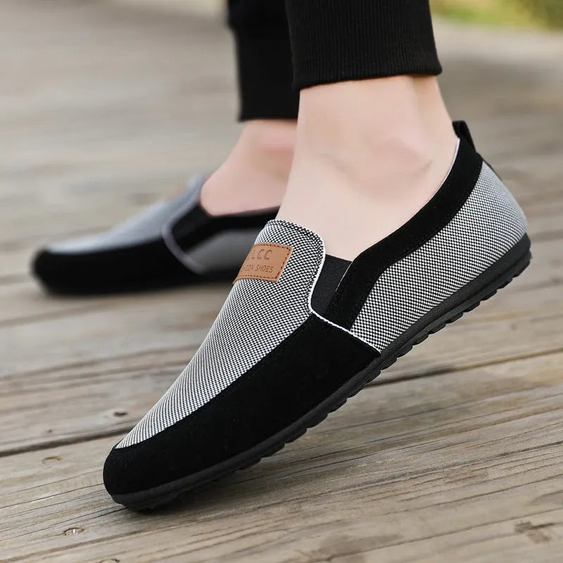 Men's grey and khaki canvas casual board shoes with round toe and rubber sole.