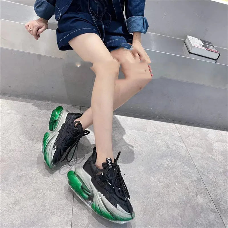 Women's green leather high-top sports shoes with a thick jelly sole and cross-lace fastening.