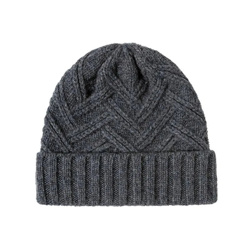 A woman's wool knitted winter hat in a dome crown style, shown in ankela red colour.
