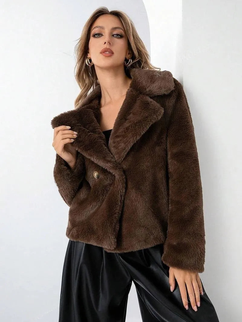 A women's rose red loose-fit short faux fur coat with regular sleeves on a hanger.