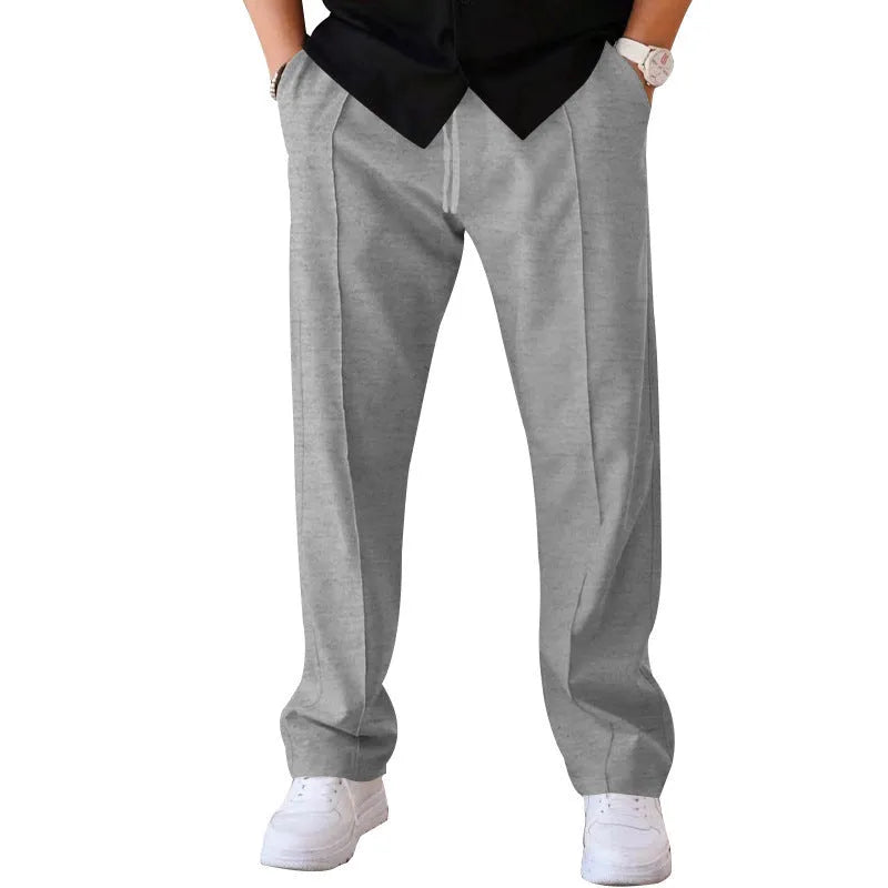Men's loose straight trousers in waffle polyester with drawstring, available in multiple colours including black and light grey