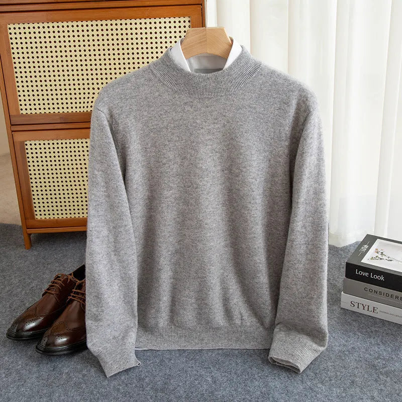 Man wearing a chunky knit half-turtleneck wool sweater in a loose fit.