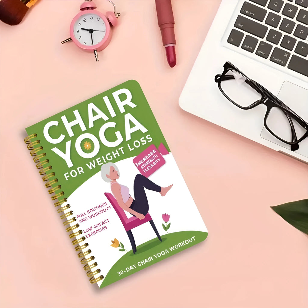 Green coil-bound yoga training notebook showing 30-day calendar pages and yoga programme content