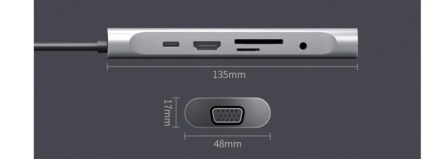 Grey aluminium USBC docking station with HDMI, VGA, USB ports and a short attached cable on a wooden desk