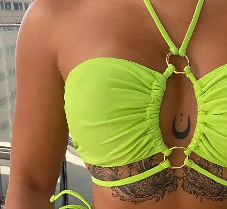 Women's yellow green lace-up triangle bikini swimsuit on mannequin