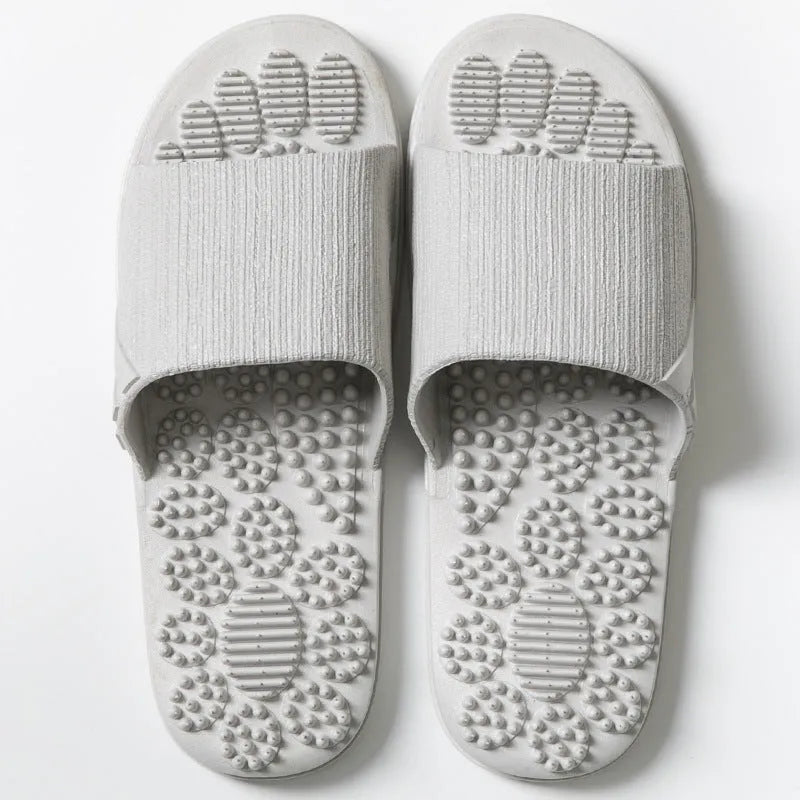 Reflexology acupressure slippers in EVA material with 3D massage particles, available in blue, grey, light blue, pink, purple
