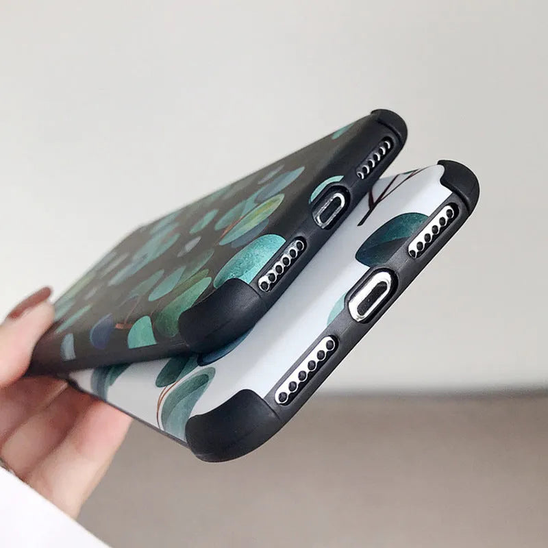 Black silicone iPhone case featuring a raised leaf pattern design on the back.