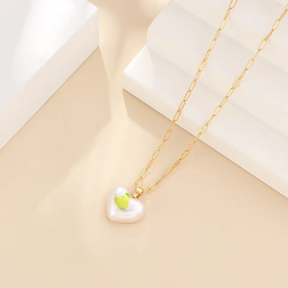 Adjustable necklace with heart charm and fruit pendant on 21-50cm chain