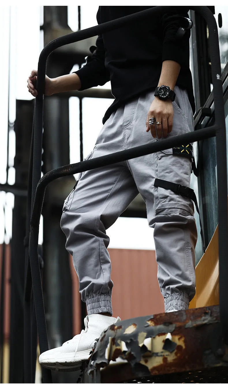 Men's cotton cargo pants in black, grey, and khaki, casual multi-pocket trousers with size chart.