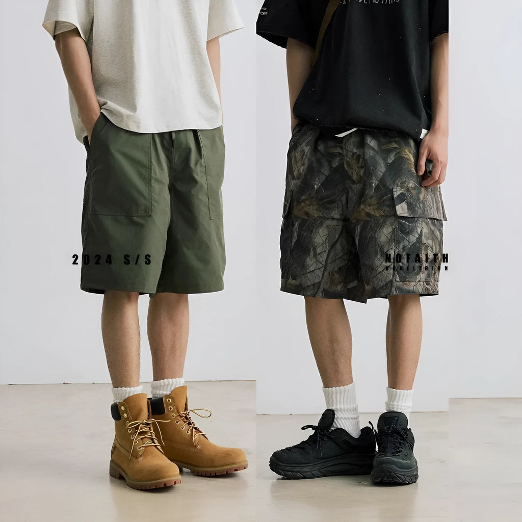 Loose casual straight-leg denim shorts in black on a hanger, showing mid waist and zip fly.