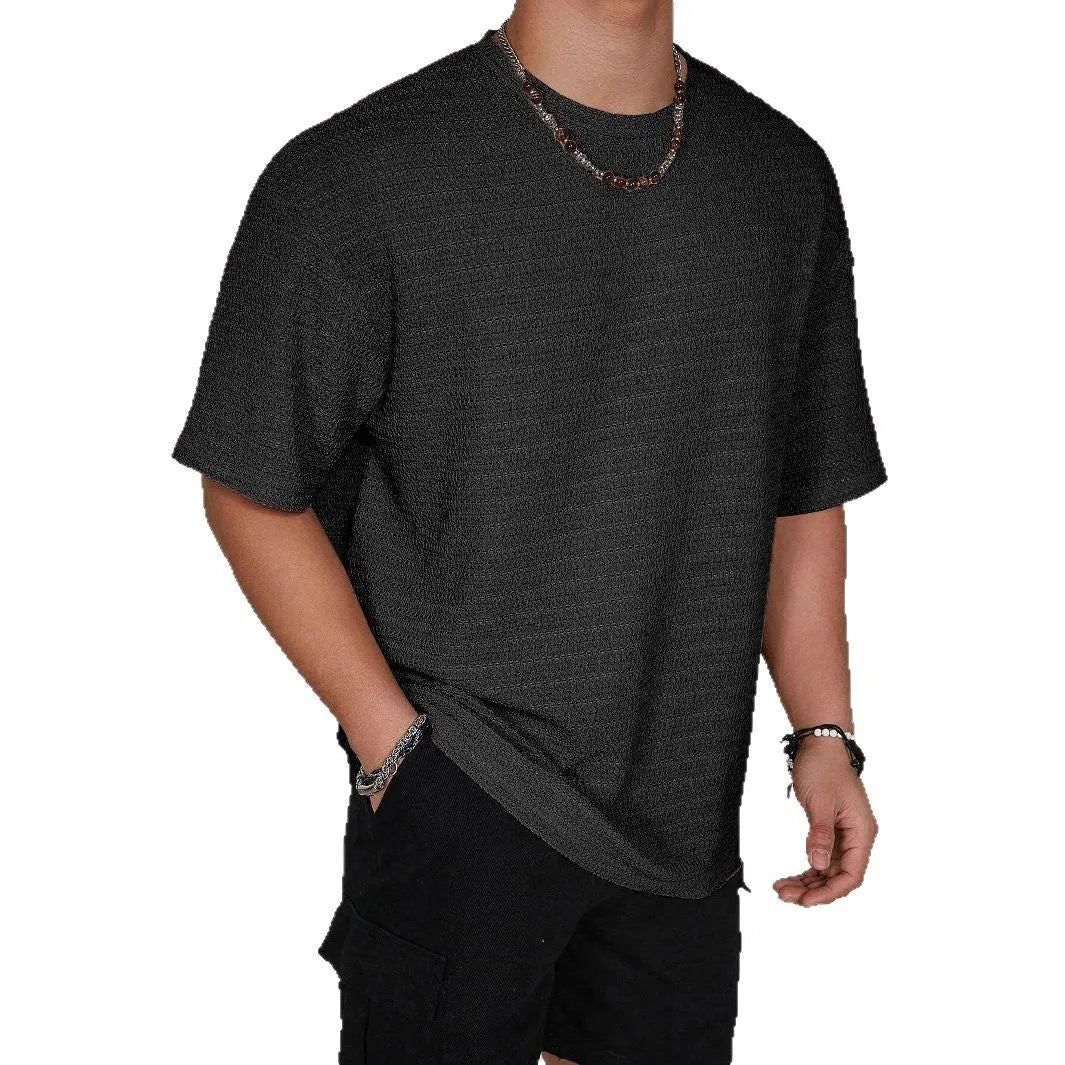 Men's slim fit short sleeve t-shirt in light blue with a round neck and loose hollow design.