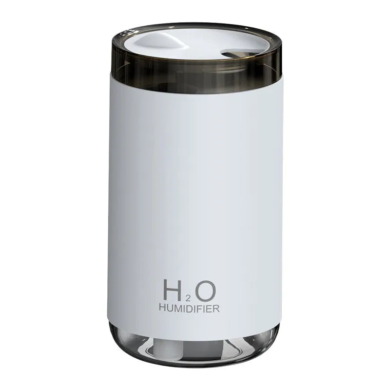 Jellyfish-shaped humidifier producing smoke ring mist with warm night light illumination