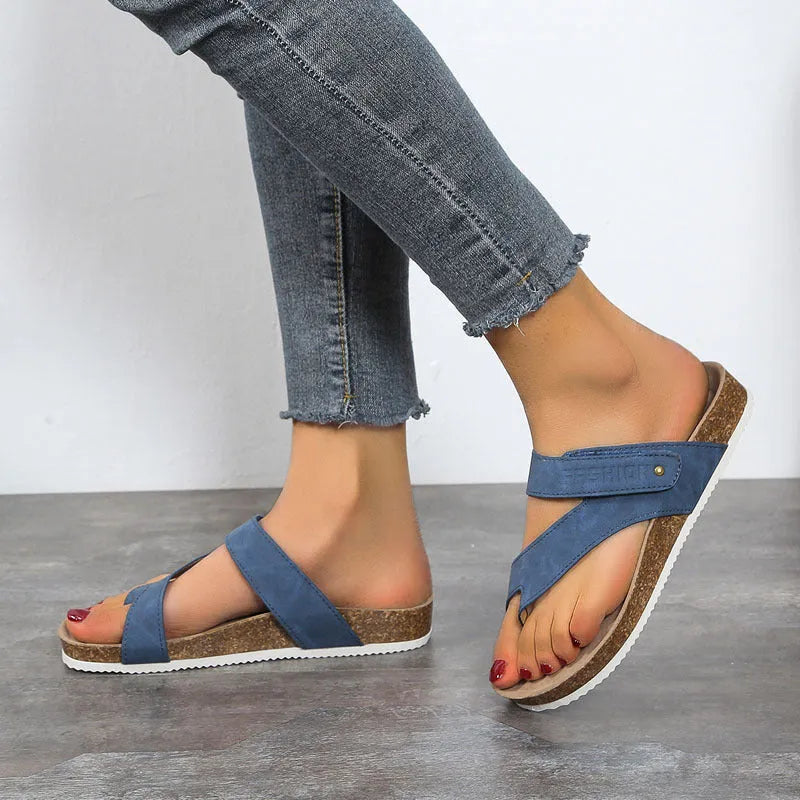 Flat toe ring thick-soled flip-flops in blue, showing foam sole and PU upper.