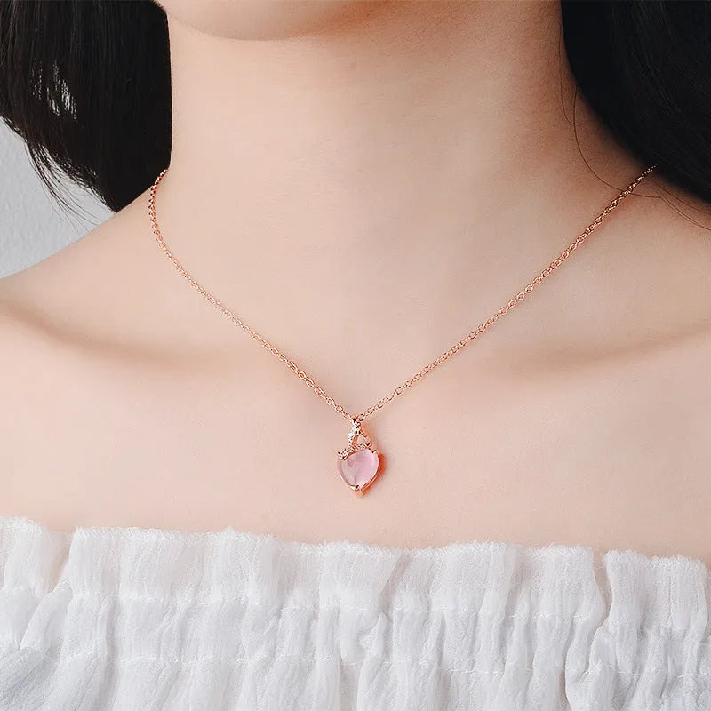Women's heart-shaped pink artificial crystal pendant necklace on rose gold cross chain