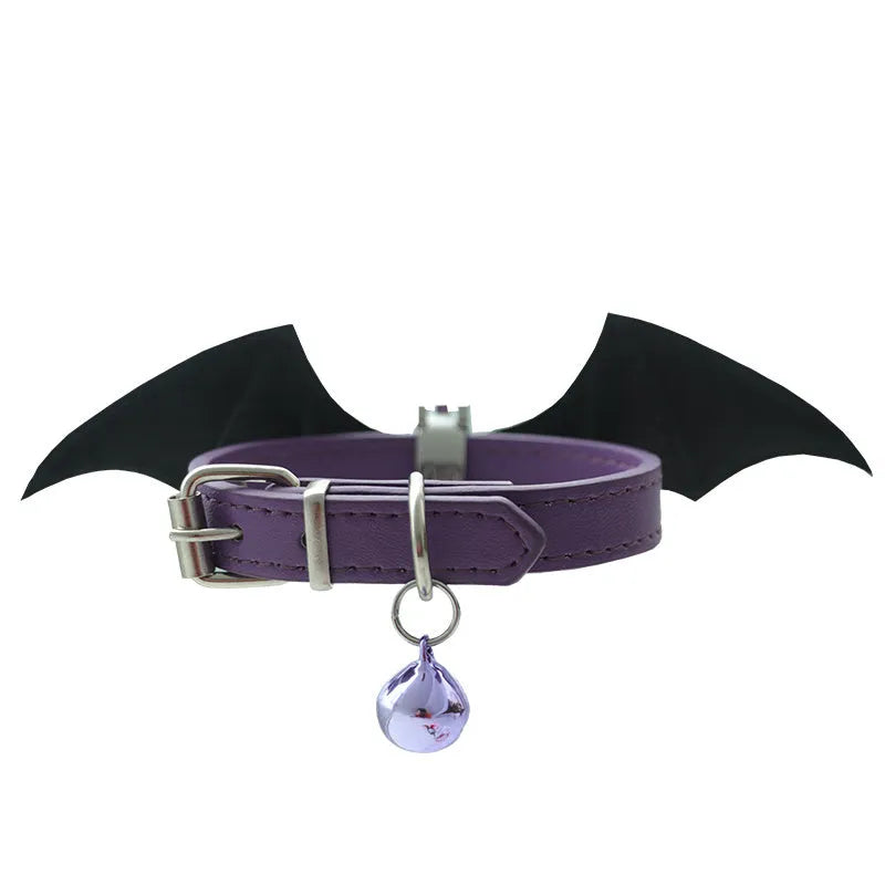 Leather dog collar with split devil wings design and bell attachment in patent leather satin material