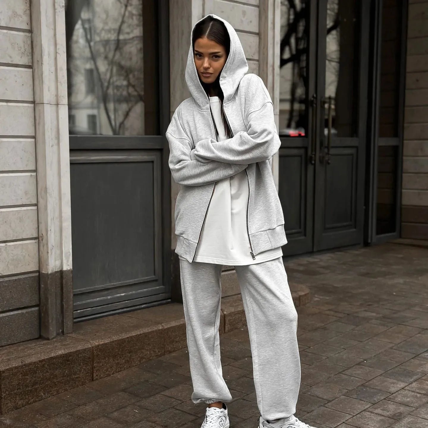 Red loose-fit street style two-piece set with long-sleeved coat and trousers on a model.