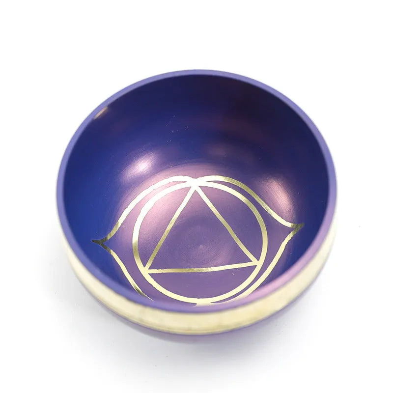 Seven colourful handmade Himalayan-style bowl percussion instruments arranged by size and colour