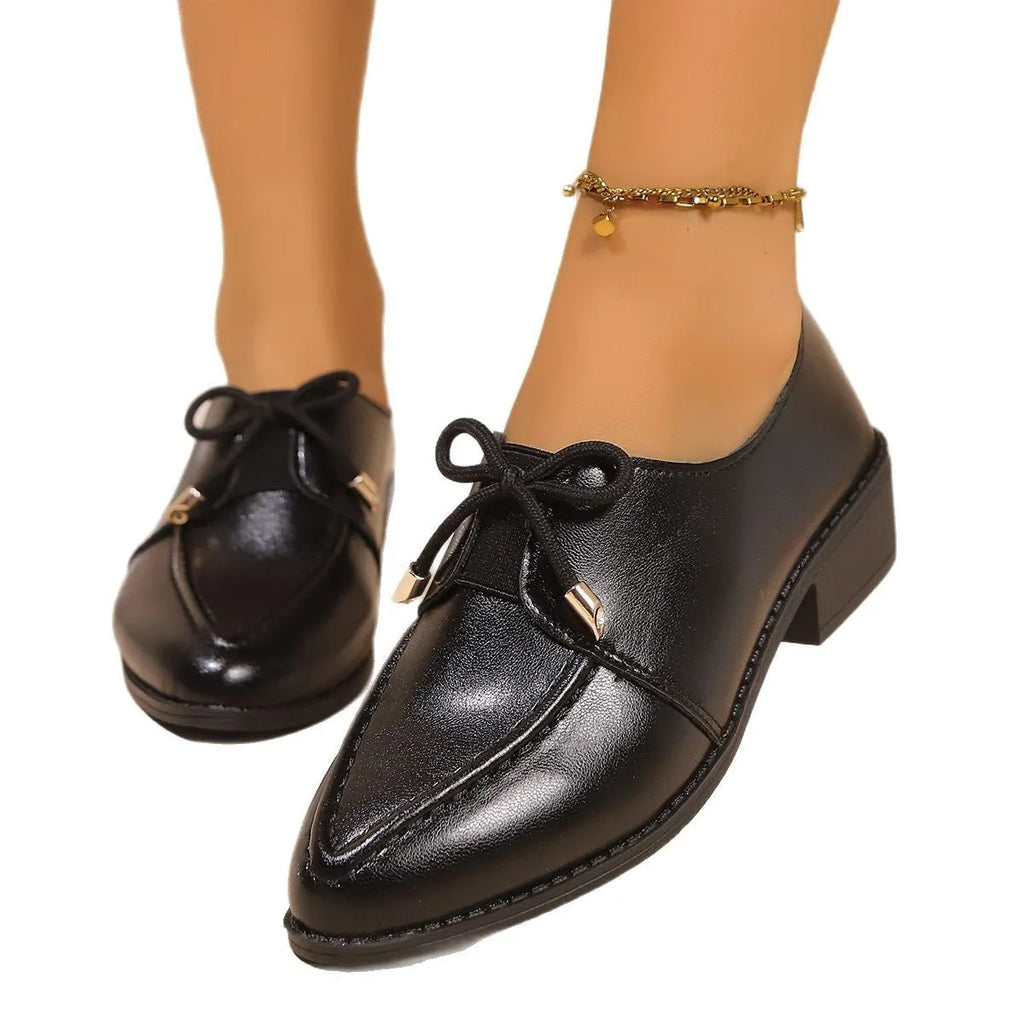 Women's simple leather shoes with a choice of large buckle bow or small bowknot decoration, pointed toe, and rubber sole.