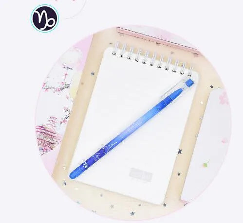 Box of 12 constellation-themed quick-drying gel pens with plastic bodies and coloured caps