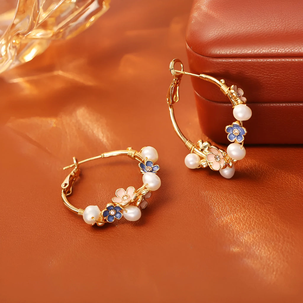 Natural freshwater pearl flower earrings with gold-plated copper setting, pair of earrings on display