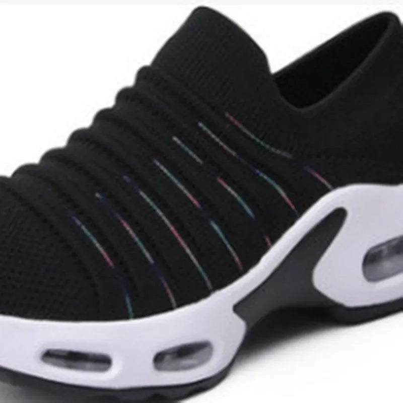 Women's plus size fly-knit socks shoes in stretch mesh with low heel and round toe.