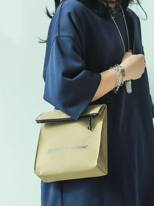 Simple all-match messenger bag backpack in polyester with adjustable crossbody strap, showing sewing line detail
