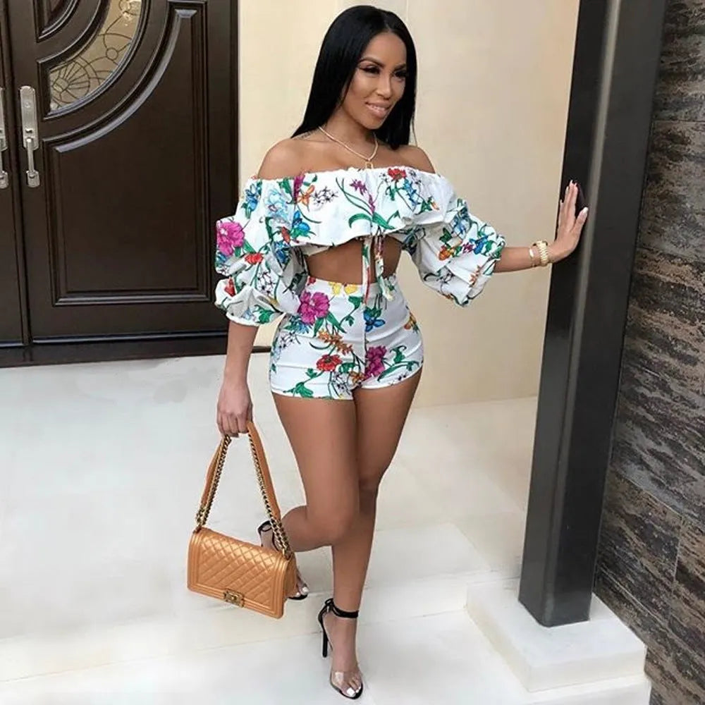 Women's multicolour digital print lounge set with puff-sleeved top and shorts.