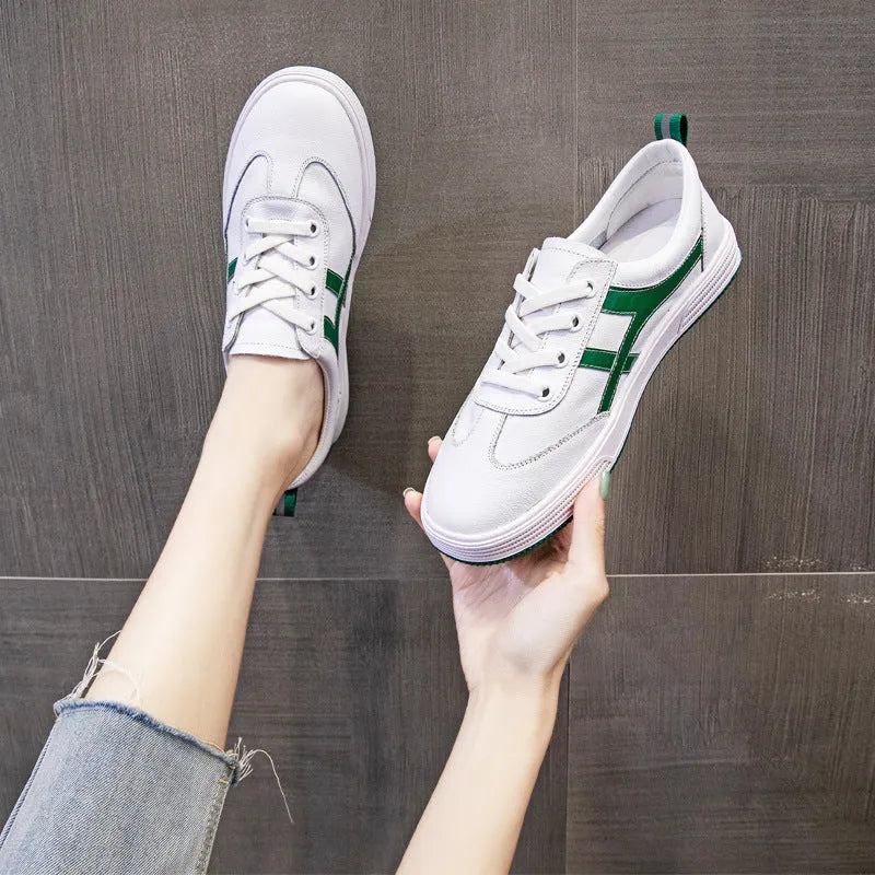 Women's black and white cowhide leather sneakers with elastic band fastening and rubber soles