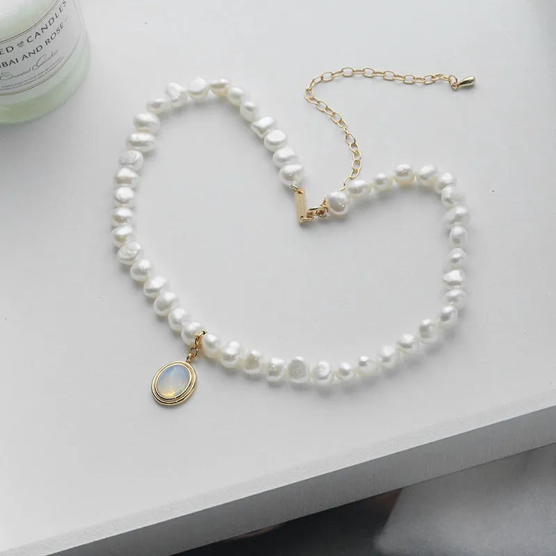 Silver necklace with round medal and irregular pearl geometric pendant on adjustable chain
