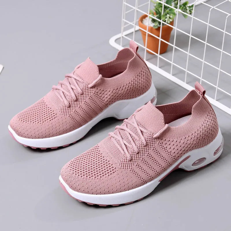 Women's lace-up casual sneaker in grey mesh with a round toe and soft PVC sole.