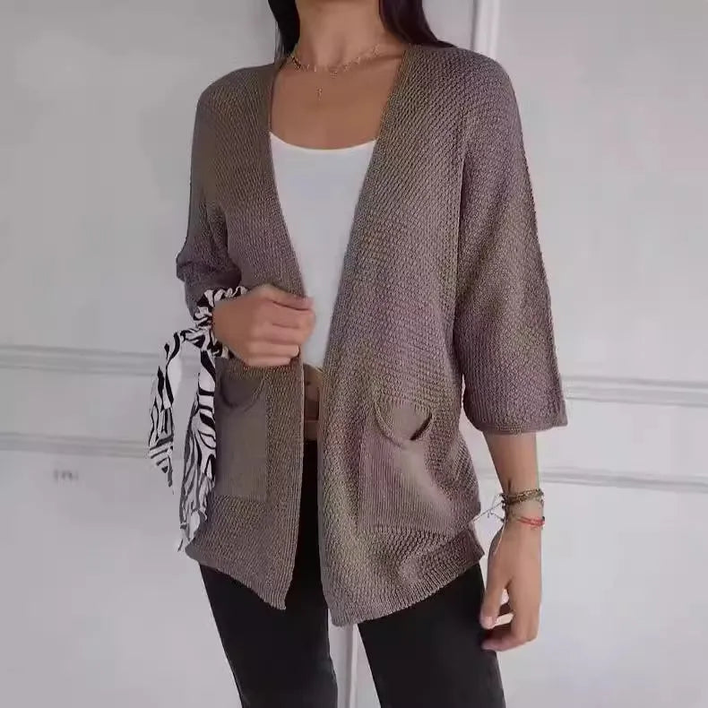 Women's waffle-textured cardigan coat in army green with nine-quarter sleeves and pockets.