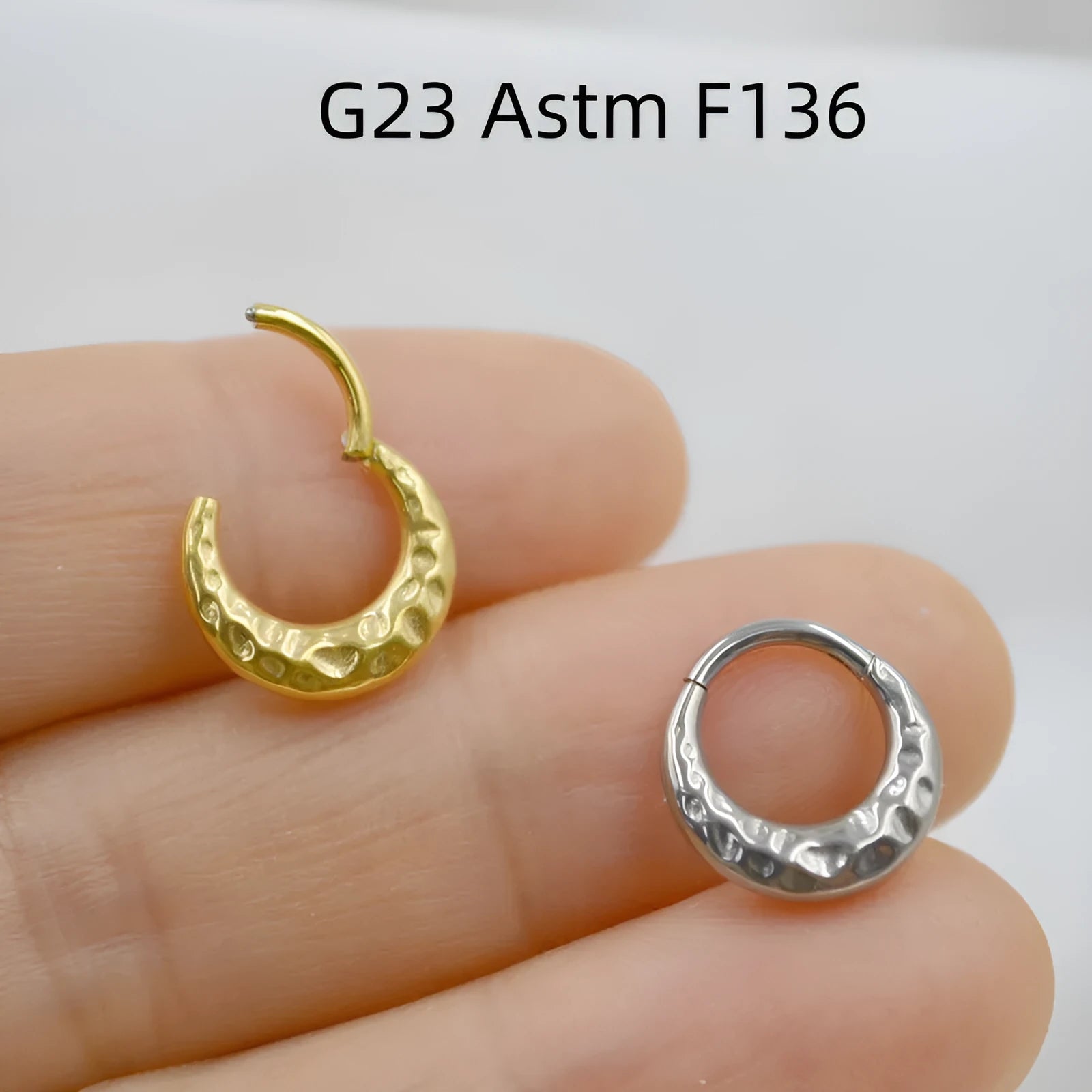 Titanium alloy concave-convex nose ring in gold or silver finish with 1.2mm thickness and 8mm or 10mm diameter options
